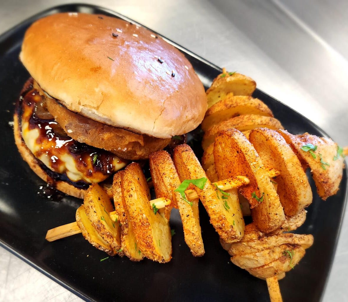 A burger served with spiral chipstix
