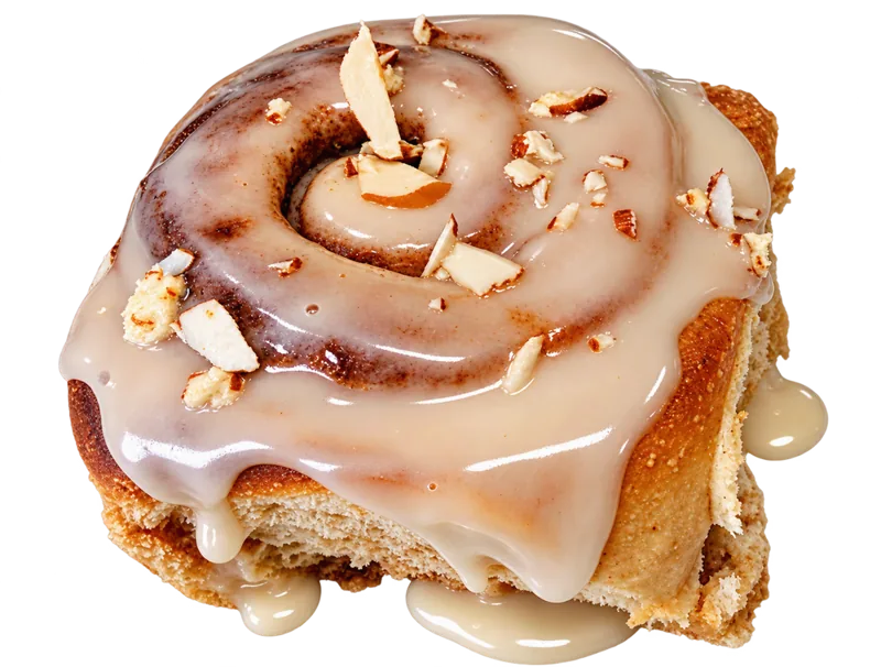 A honey-glazed cinnamon bun topped with flaked almonds