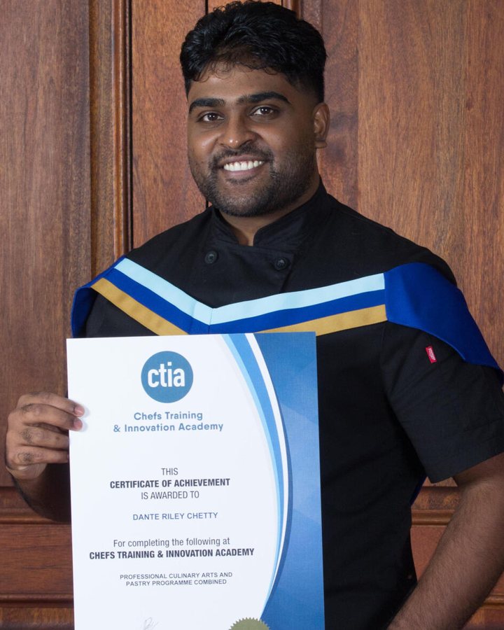 Danté Riley Chetty holding a Chefs Training and Innovation Academy certificate