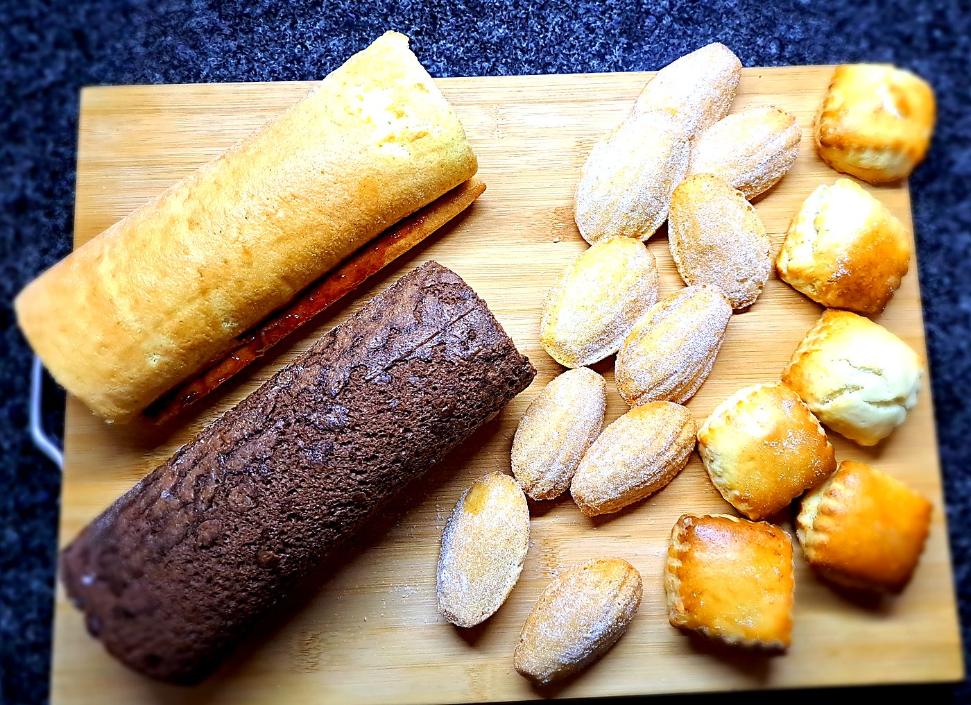 Swiss rolls with madeleines and pastries